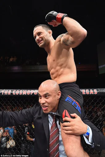 Frankie Edgar lifted onto a cornerman's shoulders after a UFC win